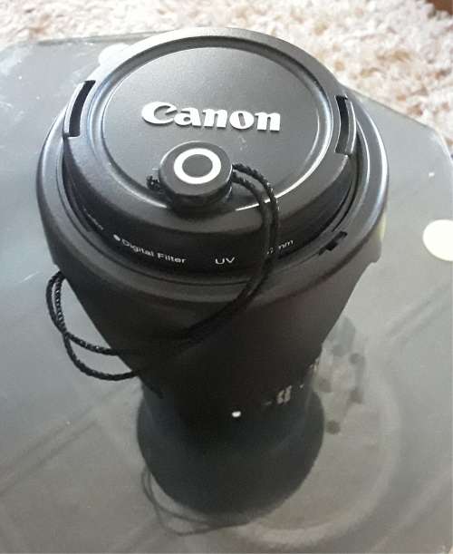 Canon 18-135 STM lens, photos show exatc item an  sale, like new inside and out.