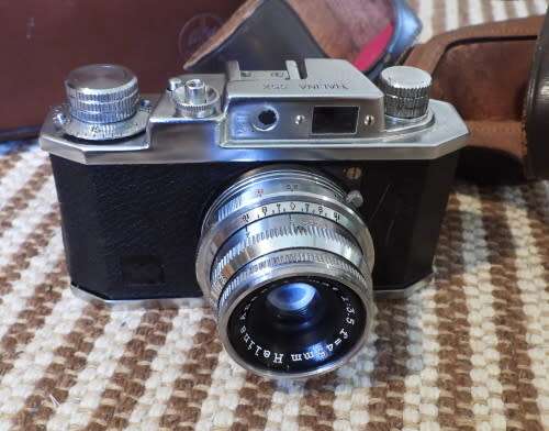 Old Bolex 8mm movie and a small film camera, photos show exact items, sold as pair
