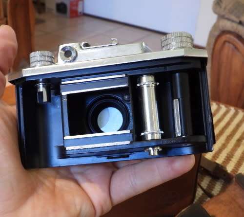 Old Bolex 8mm movie and a small film camera, photos show exact items, sold as pair