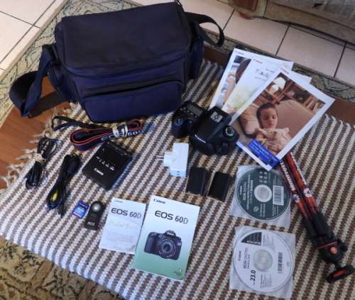 Canon 60D body only with accesories shown in Photo, has some minor signs of ues, good condition,