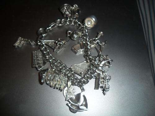 GORGEOUS SOLID SILVER BRACELET AND CHARMS