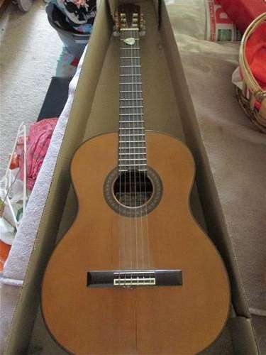 classic guitar has a crack down front of casing nylon strings