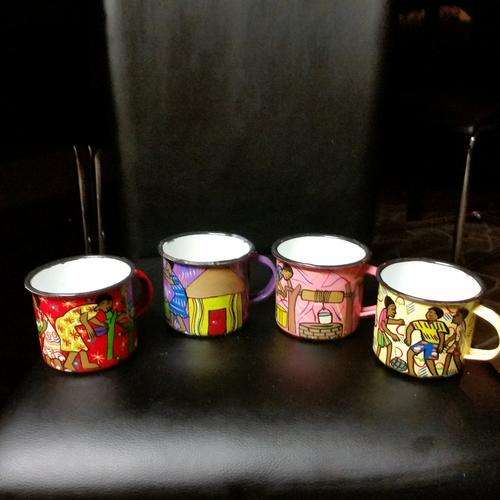FOUR VINTAGE ENAMEL CUPS WITH BEAUTIFUL HAND PAINTED AFRICAN TRIBAL ART.