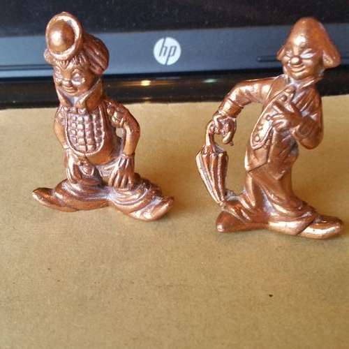 TWO SOLID COPPER CLOWNS