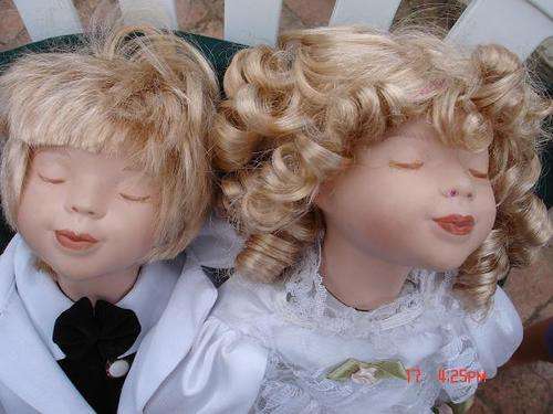 Pair of matching Porcelain Dolls