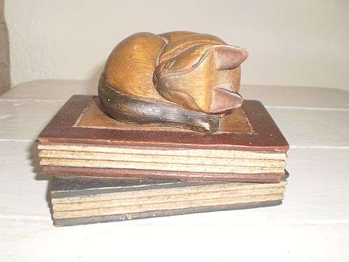 Sweet Sleeping Wooden Cat on Books
