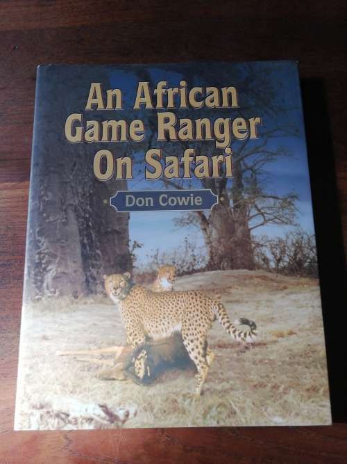 AN AFRICAN GAME RANGER ON SAFARI - Don Cowie