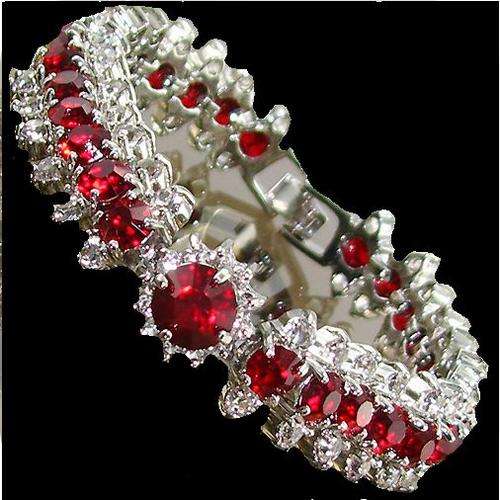 CHARMING SILVER TENNIS BRACELET WITH CHERRY RED STONES