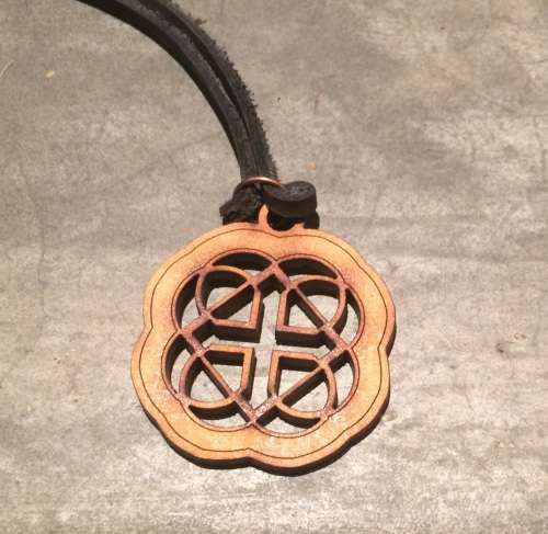Gratitude wooden pendant on a leather thong