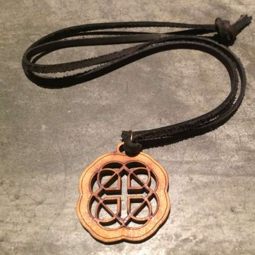 Gratitude wooden pendant on a leather thong