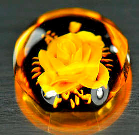 HAND CARVED FLOWER CAMEO IN AMBER (1.58 Ct)