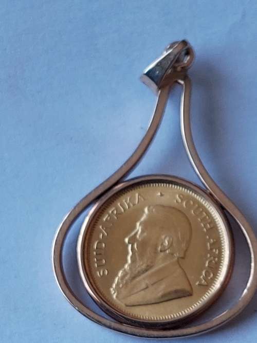1/10 oz KRUGER RAND IN 9CT GOLD PENDANT