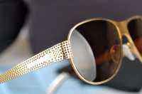 Male and female models Prada sunglasses the SPR531.