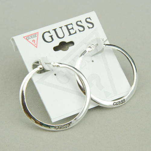 GUESS brand Round force earrings.