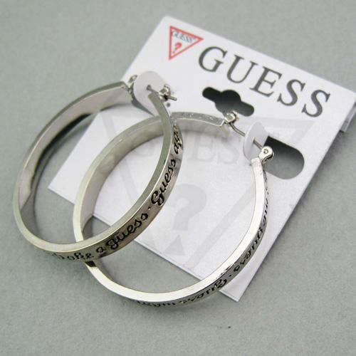 GUESS brand Round force earrings.