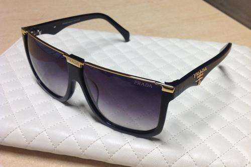 Brand new authentic PRADA SPS67N sunglasses for man in factory box.