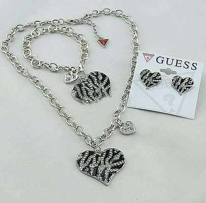 Original 2013 new exquisite studded Guess animal print necklace, bracelet and Earrings set.