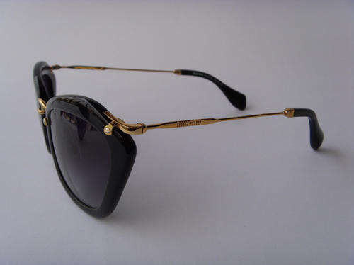 Trendy MIU MIU simple wild spot fashion female stars sunglasses.