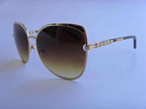 Brand new SWAROVSKI atomic studded golden sunglasses.