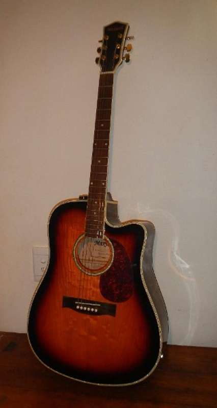 Acoustic guitar with built-in Pickup. Just plug and play!
