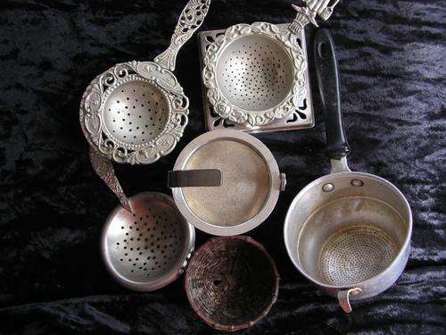 Tea Strainers and rests including an antique one
