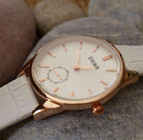 Ladies rose gold classic watch with white  face and white strap