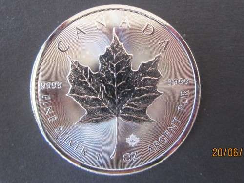 ( LOW START )    CANADIAN MAPLE     1oz .999.9% .PURE SOLID SILVER BULLION.....