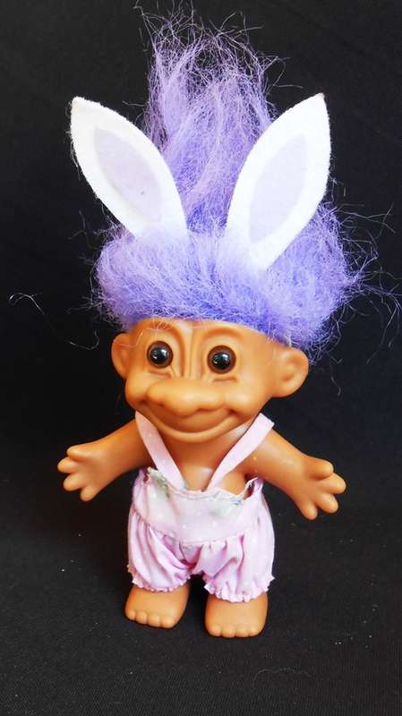 collectable Troll doll in baby suit with bunny ears