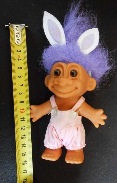 collectable Troll doll in baby suit with bunny ears