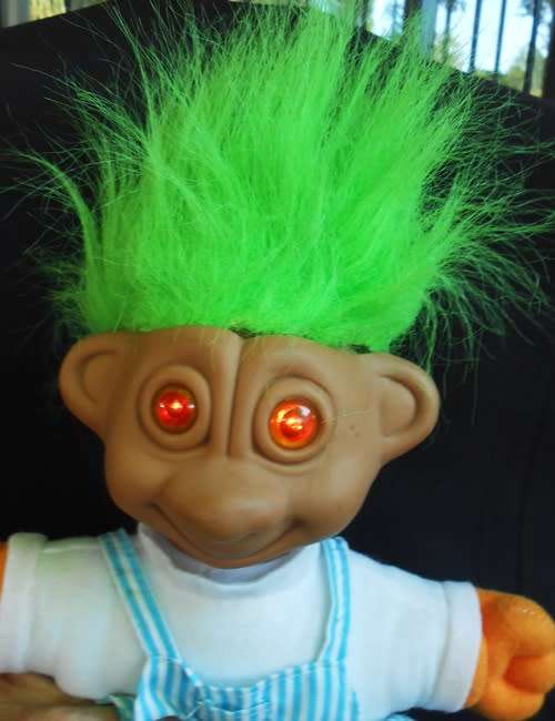 Troll doll with green hair and soft body amber eyes light up