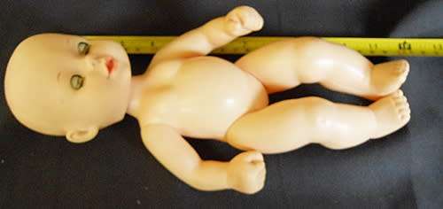 Cititoy hard plastic and vinyl doll in baby seat