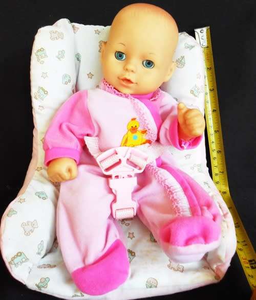 Cititoy hard plastic and vinyl doll in baby seat