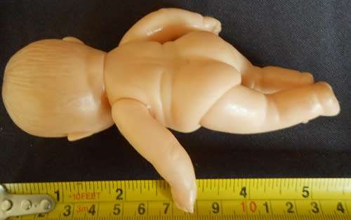 Small chubby baby doll looks like Berenguer doll with cute smile brown eyes