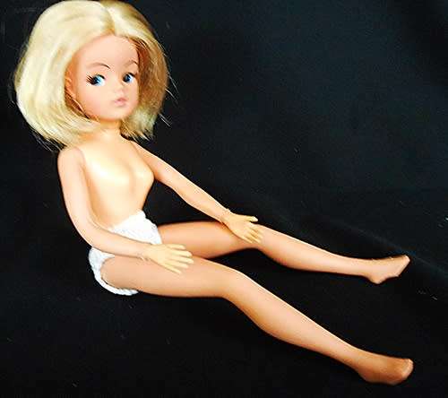 Collectable Vintage Sindy Doll with white and pink dress
