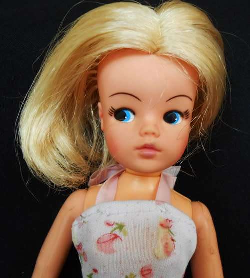 Collectable Vintage Sindy Doll with white and pink dress