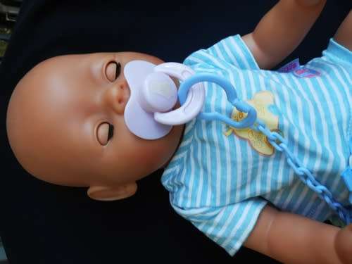 collectable Zapf Interactive Baby Born doll with dummy and rattle