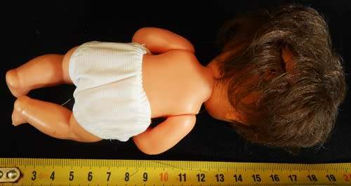 Vintage Hard Plastic and vinyl doll in original dress