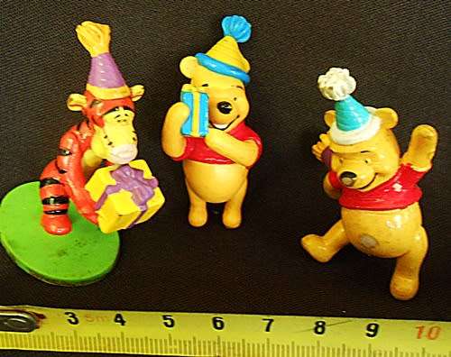 Collectable Winnie the Pooh three small characters with gifts for a party