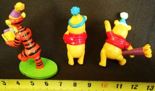 Collectable Winnie the Pooh three small characters with gifts for a party