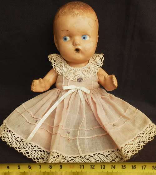 Collectable Vintage small composition doll from 1940 s in pretty dress