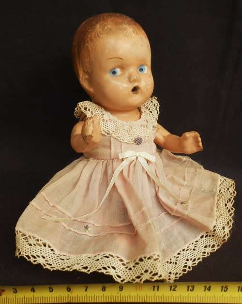 Collectable Vintage small composition doll from 1940 s in pretty dress