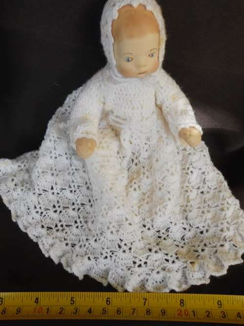 collectable handmade porcelain baby doll in fine crotchet dress