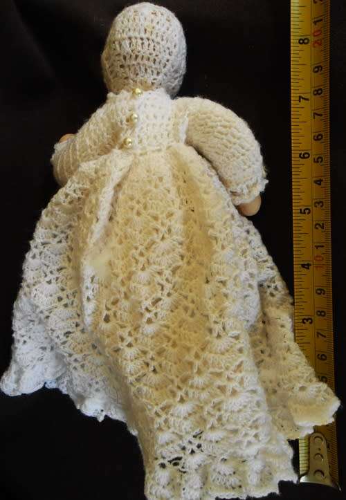 collectable handmade porcelain baby doll in fine crotchet dress