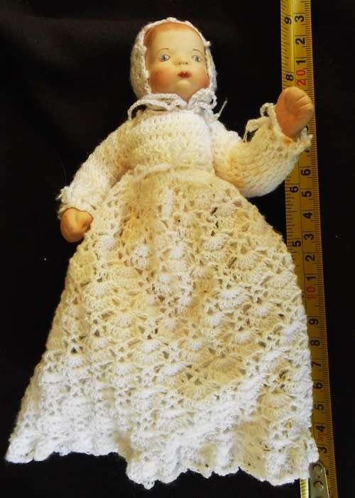 collectable handmade porcelain baby doll in fine crotchet dress