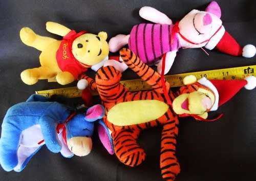 Collectable set of four Winnie the Pooh plush characters in a Christmas mood. made for woolworths