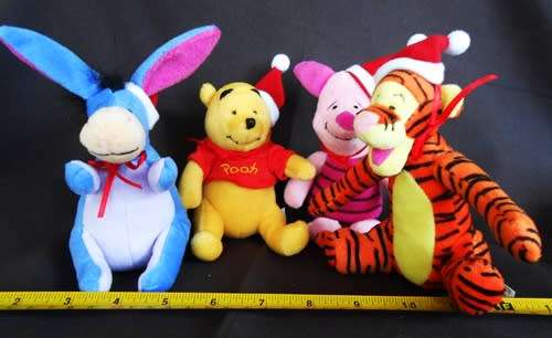 Collectable set of four Winnie the Pooh plush characters in a Christmas mood. made for woolworths