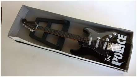 Miscellaneous * Collectables * Miniature imitation music instruments * Guitar * Police * R120,00