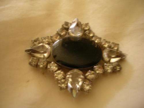 brooch with black stone