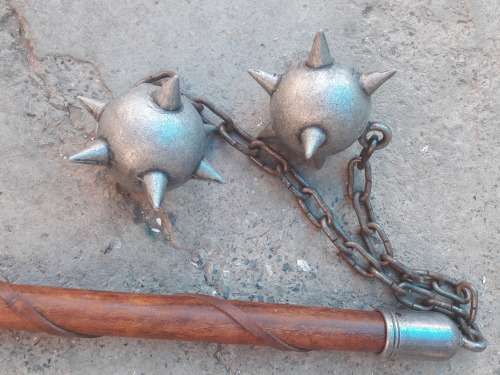ornamental spike balls on chain with wooden handle