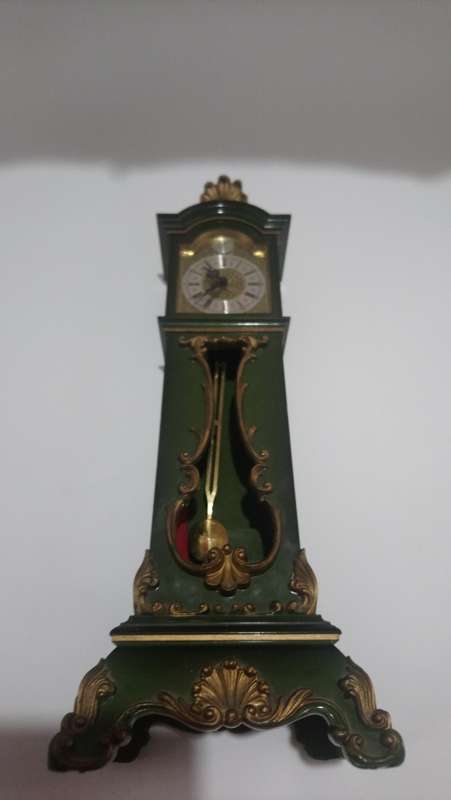 small grandfather clock pendulum
